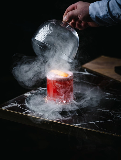 Steaming pink cocktail, served at the restaurant Dans le Noir ?