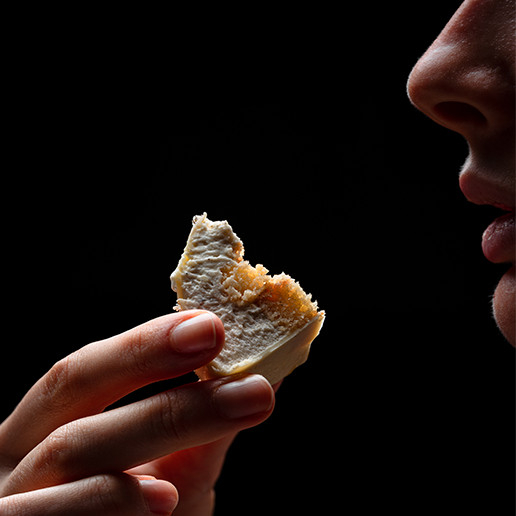 Woman enjoying a bite at the Dans le Noir ? restaurant