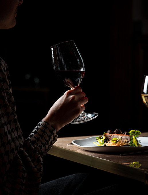 Tasting a food and wine pairing during a special Mother’s Day dinner at the Dans le Noir ? restaurant